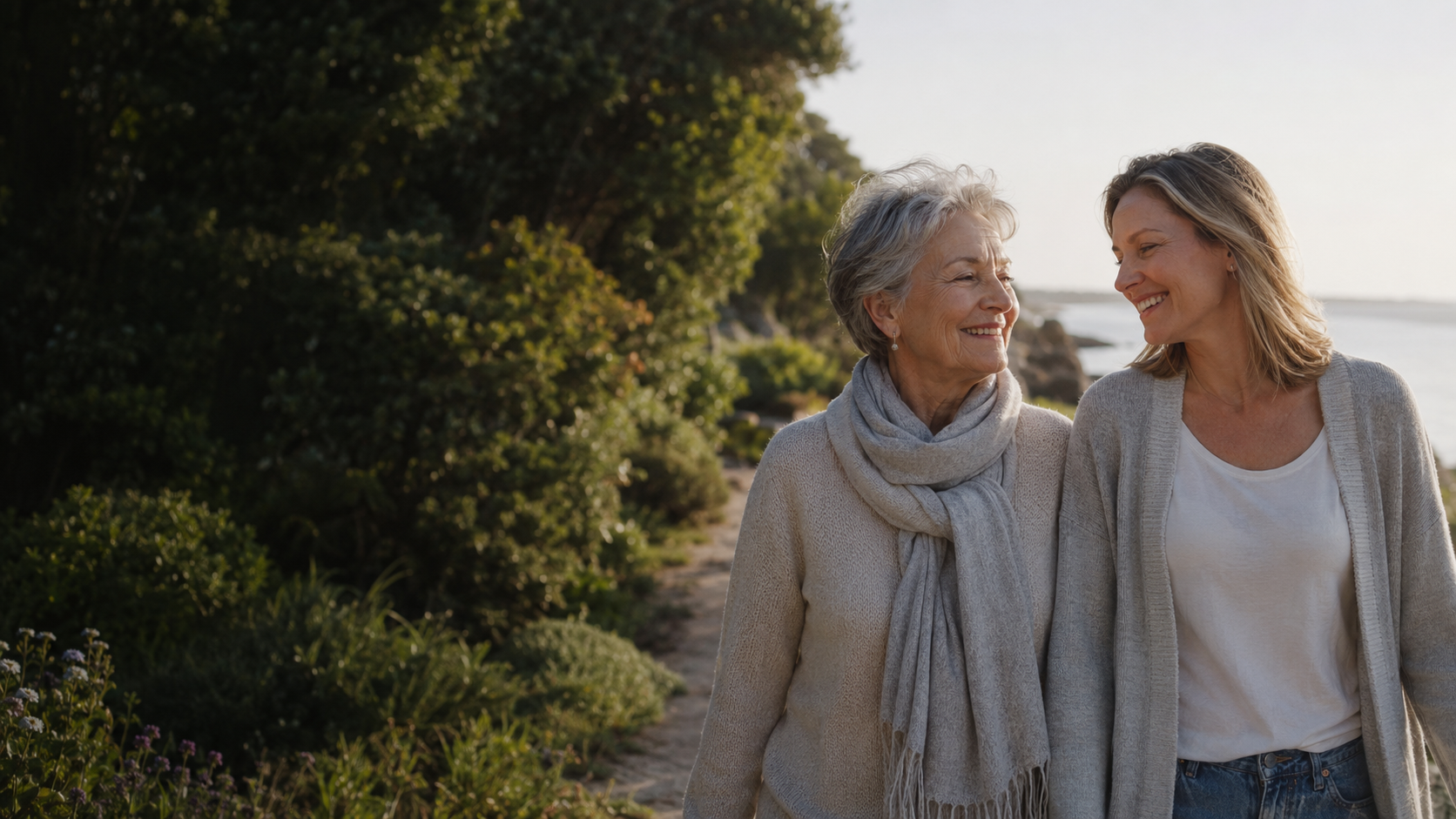 An older woman and her adult daughter enjoying time together outdoors